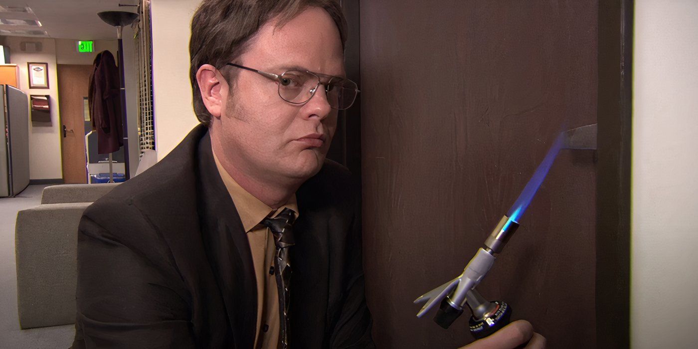 Dwight (Rainn Wilson) heats a door handle with a torch in &lsquo;The Office&rsquo;