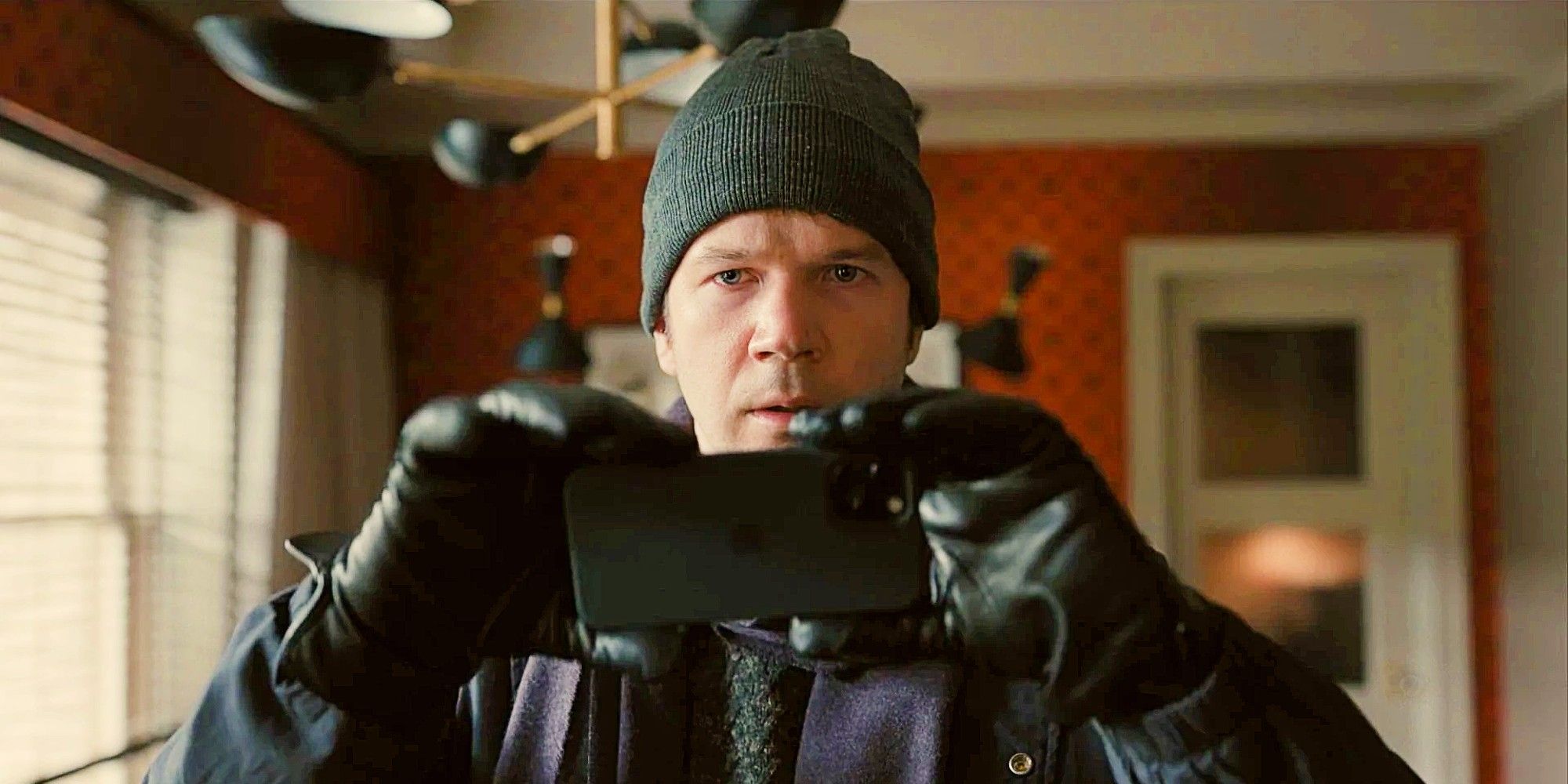 Theo Dimas taking a picture on his phone in Only Murders in the Building OMITB
