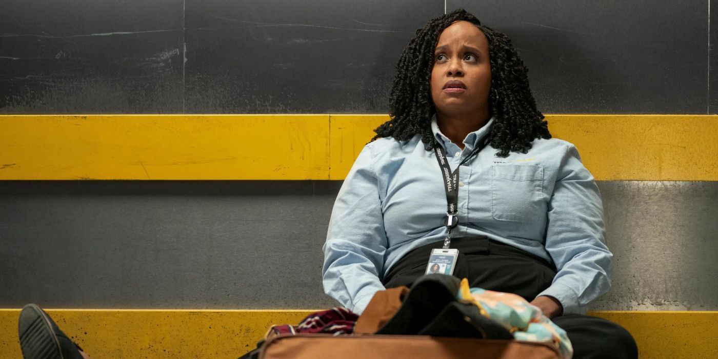 Natasha Rothwell as Mel sits and looks concerned in How to Die Alone.