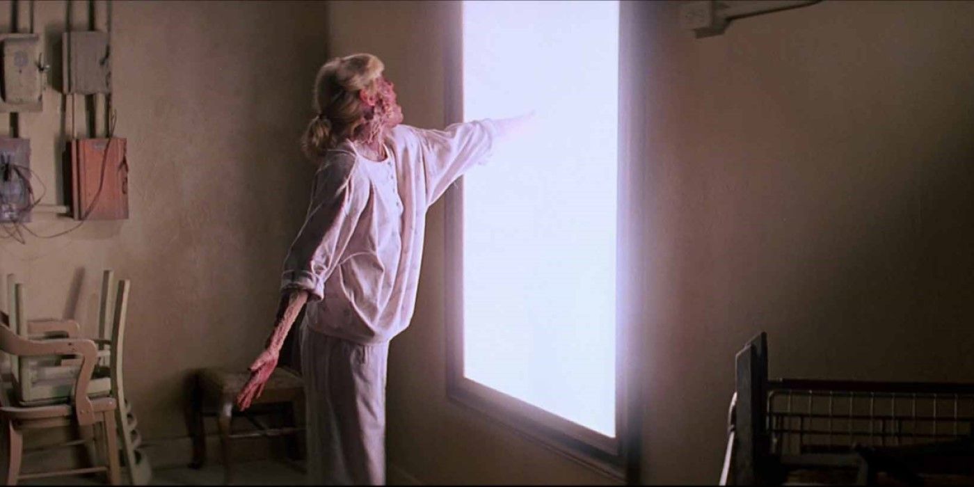 A woman reaches through a mirror in 'Prince of Darkness'