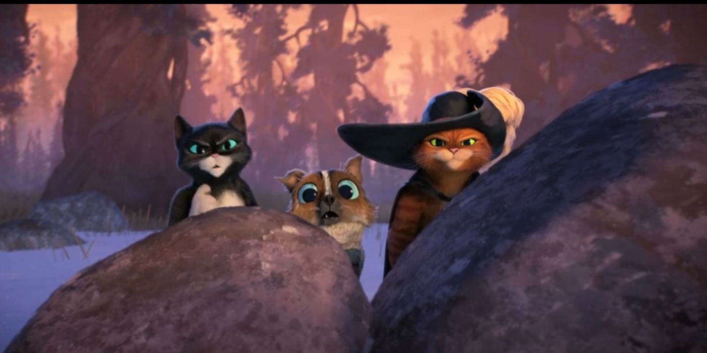 Kitty Softpaws, Perrito and Puss in Boots hide behind rocks in Puss in Boots: The Last Wish.