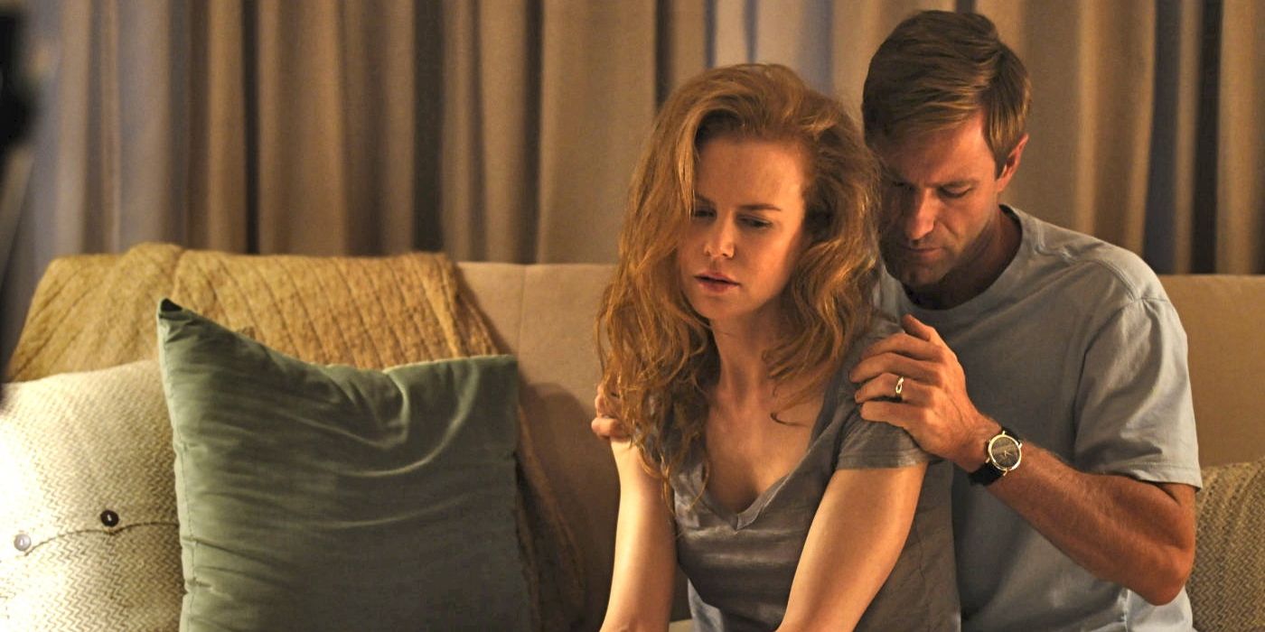 Nicole Kidman and Aaron Eckhart sit on a couch, distraught, in Rabbit Hole