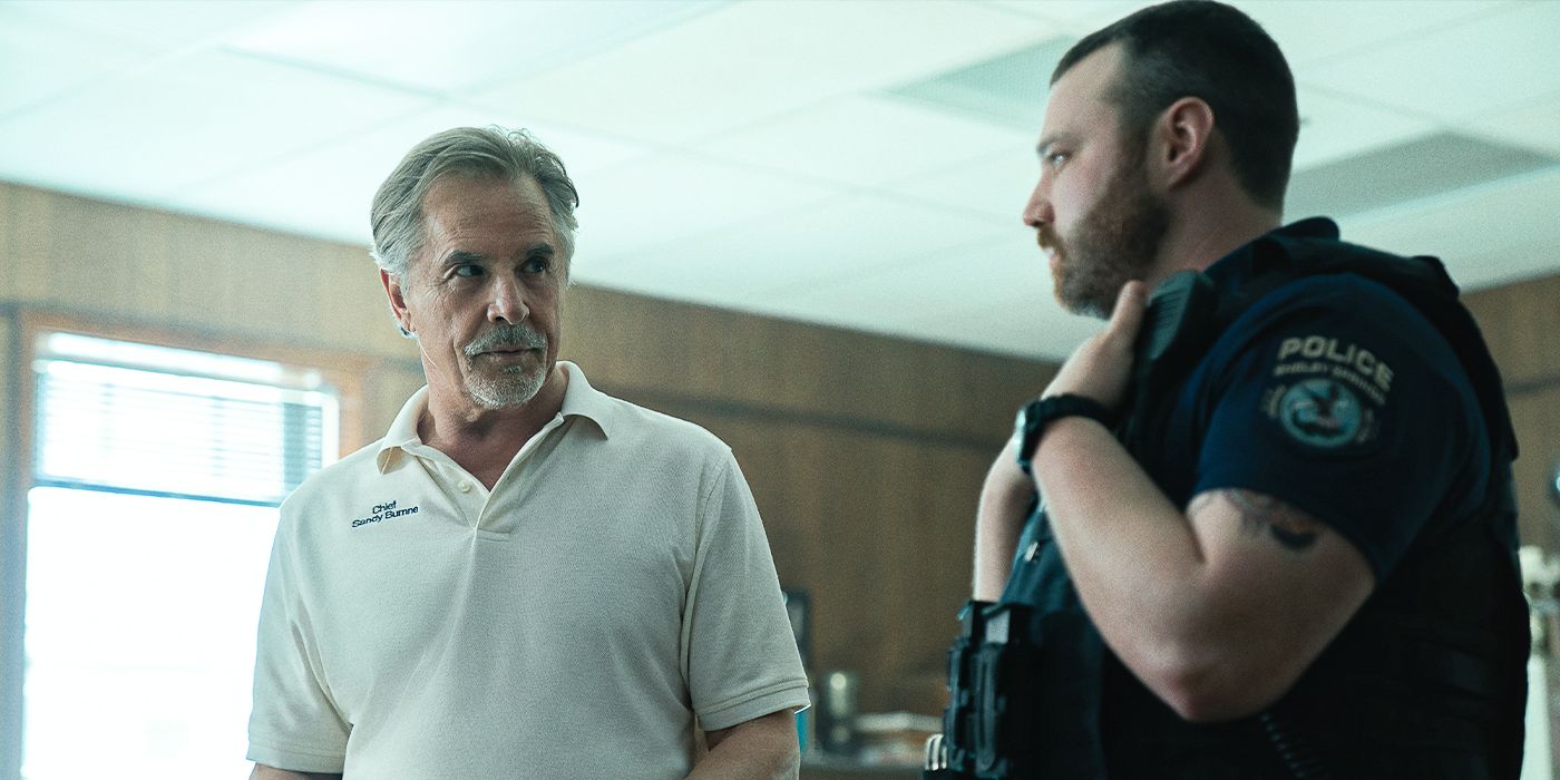 Chief Sandy Burnne and Officer Steve Lann stare at each other in a police station