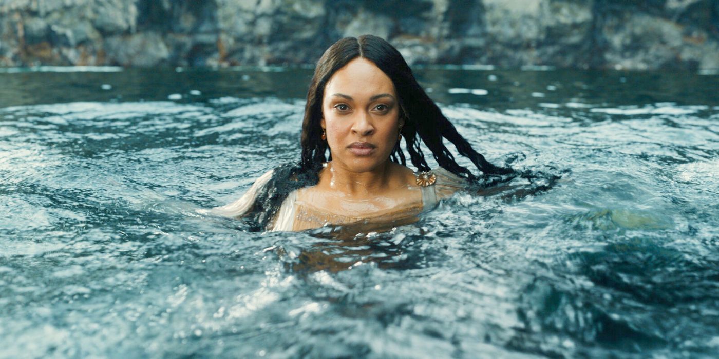 Miriel (Cynthia Addai-Robinson) floating with her shoulders above the ocean water and facing down the camera in Rings of Power Season 2