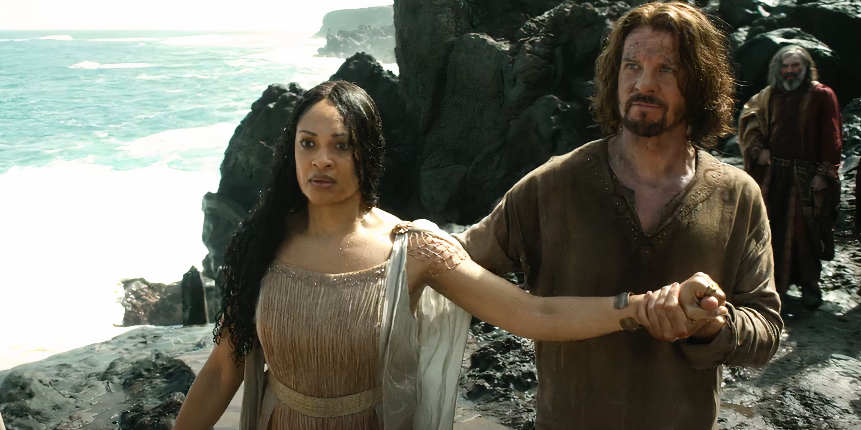 Elendil (Lloyd Owen) walking with Miriel's (Cynthia Addai-Robinson) in The Lord of the Rings: The Rings of Power