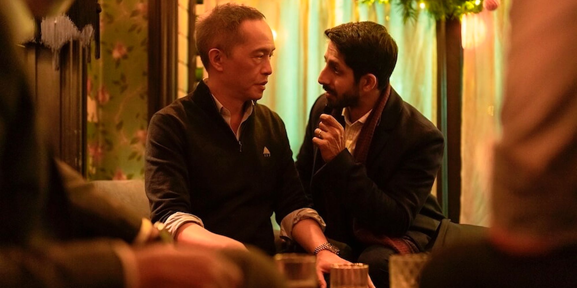 Rishi (Sagar Radia) and Eric (Ken Leung) talking to each other in Industry Season 3.