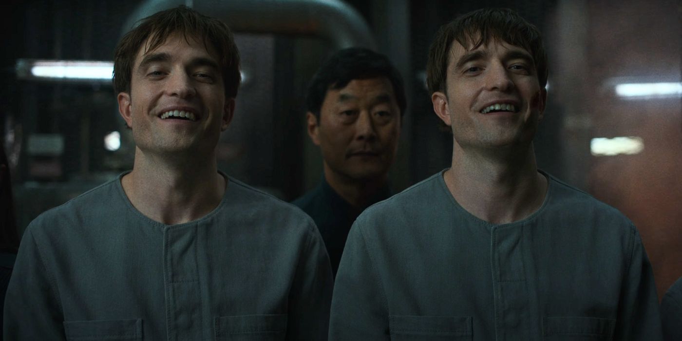 Robert Pattinson as two Mickey clones giggling beside one another in Mickey 17.