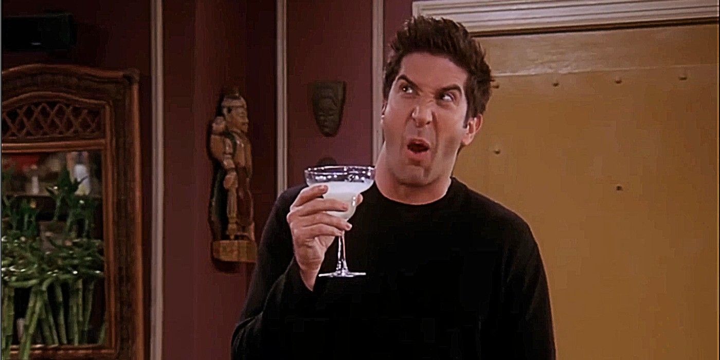 Ross Geller making a strange face while holding a margarita in Friends