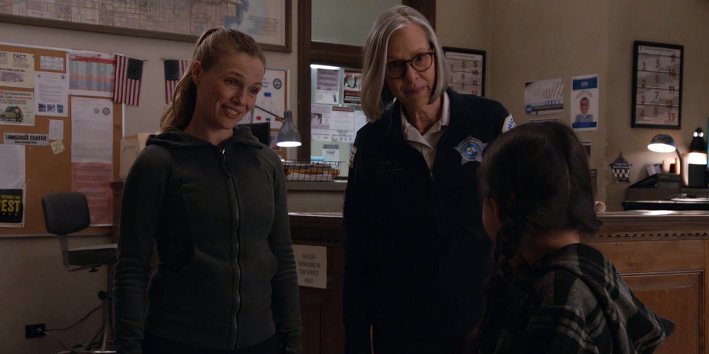 Tracy Spiridakos as Hailey Upton and Amy Morton as Trudy Platt speak to a young girl in the precinct in Chicago P.D.