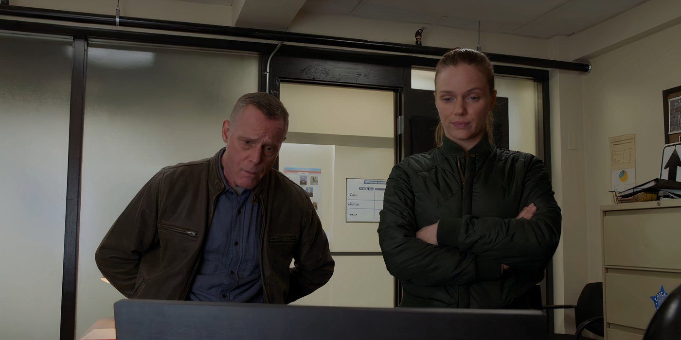 Jason Beghe as Hank Voight and Tracy Spiridakos as Hailey Upton watch a video in Chicago P.D.