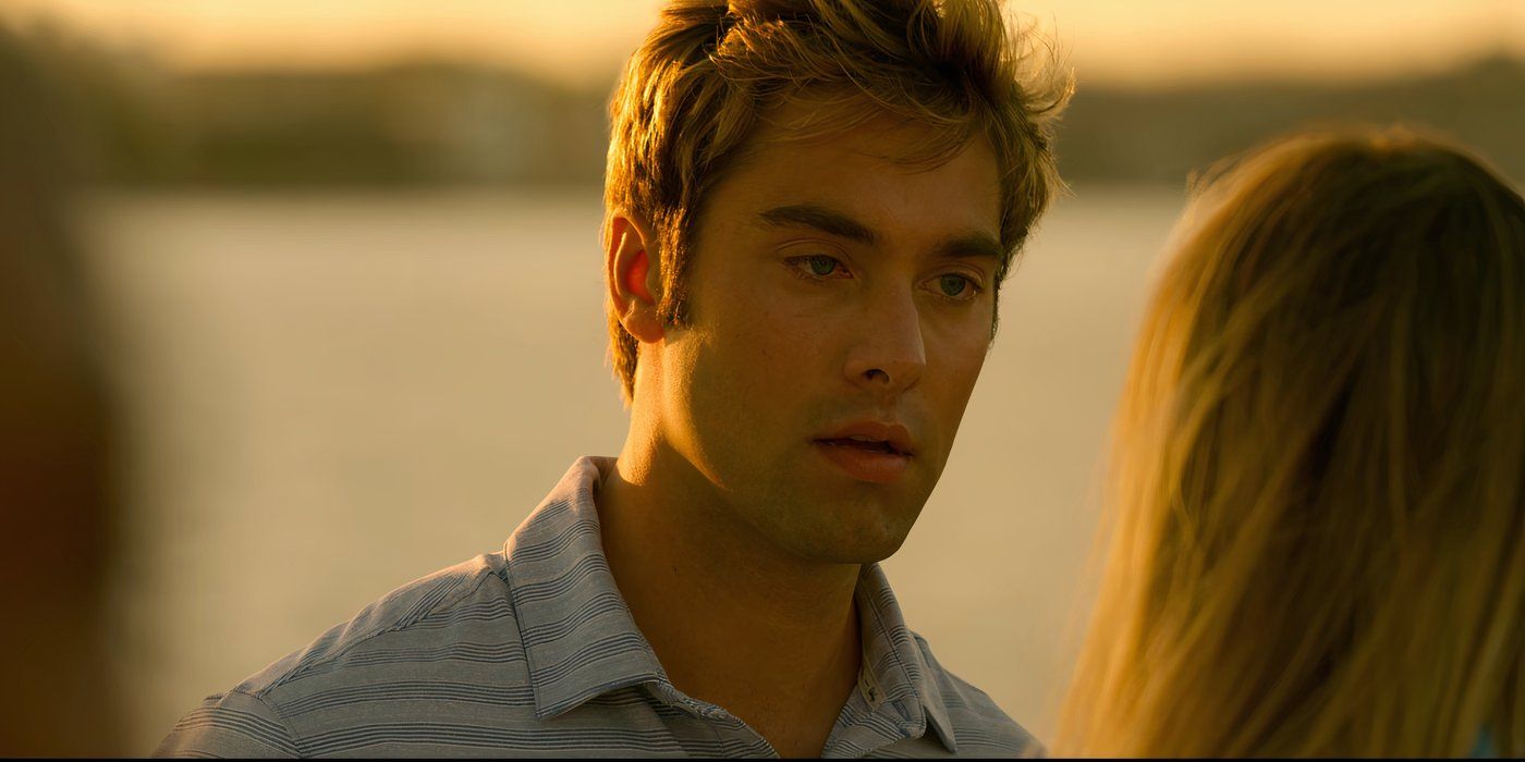 Austin North as Topper talks to Madelyn Cline as Sarah Cameron in Outer Banks.