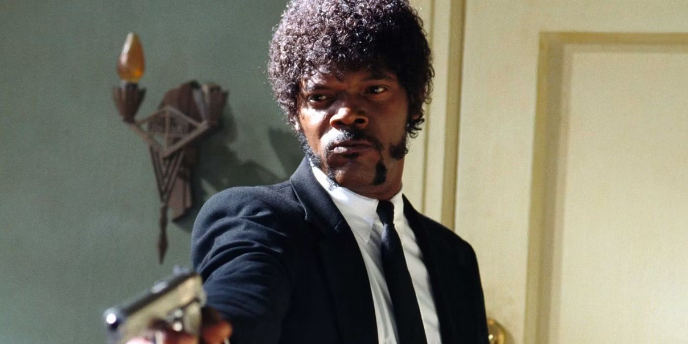 Jules Winfield aiming his gun at someone off-camera in Pulp Fiction (1994)