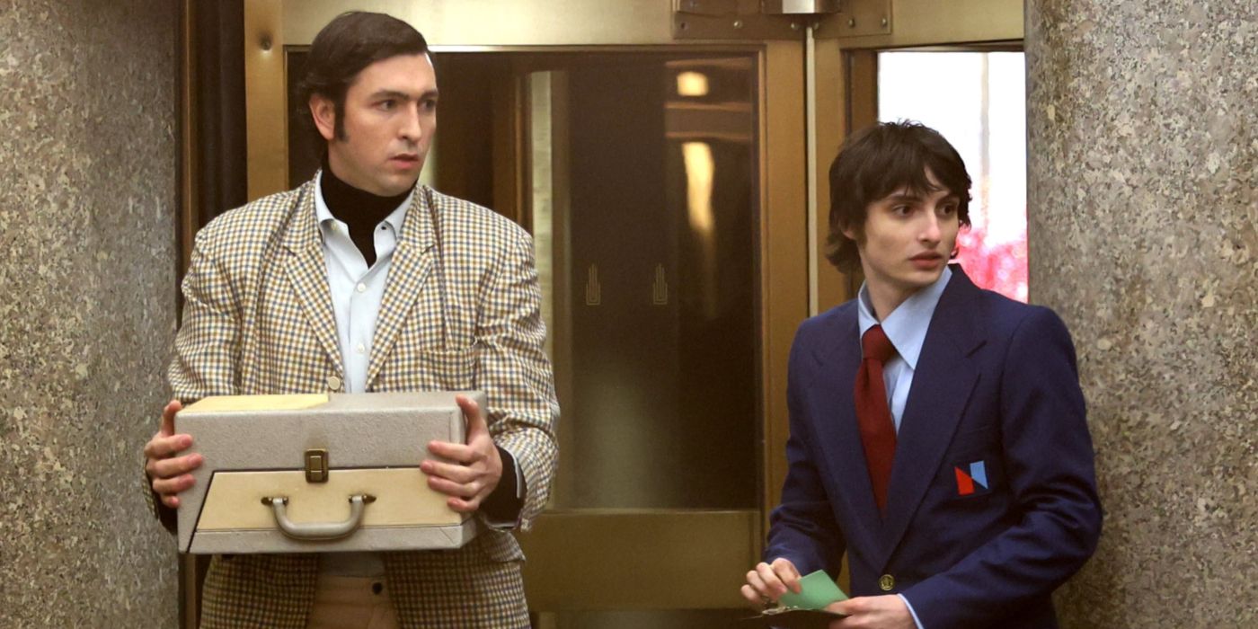 Nicholas Braun and Finn Wolfhard standing outside 30 Rock in Saturday Night