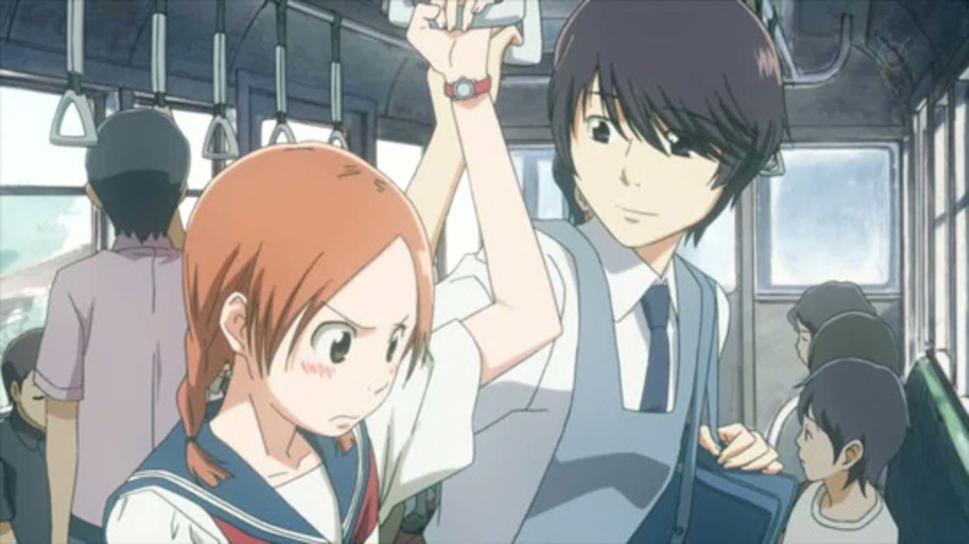 The two main characters on a bus in Sweet Blue Flowers 