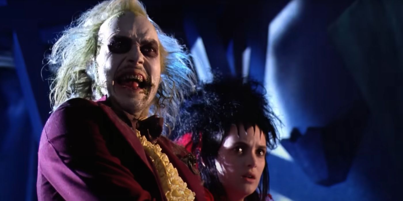 Betelgeuse (Michael Keaton) forces Lydia (Winona Ryder) to marry him in Beetlejuice (1988).