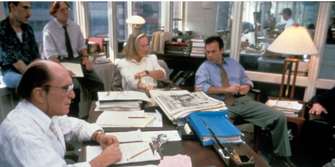 Robert Duvall, Glenn Close and Michael Keaton as Bernie, Alicia and Henry, sitting in the office and talking in “The Paper”