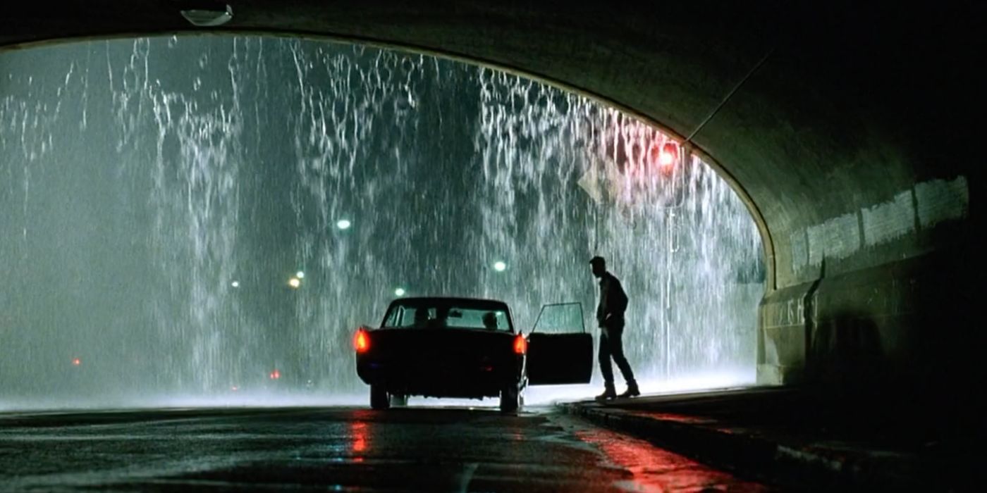 The rainy noir influences seen in The Matrix (1999).