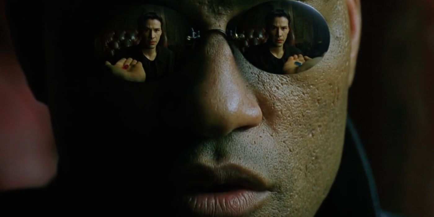 Morpheus (Laurence Fishburne) offers Neo a blue pill and a red pill in The Matrix (1999).