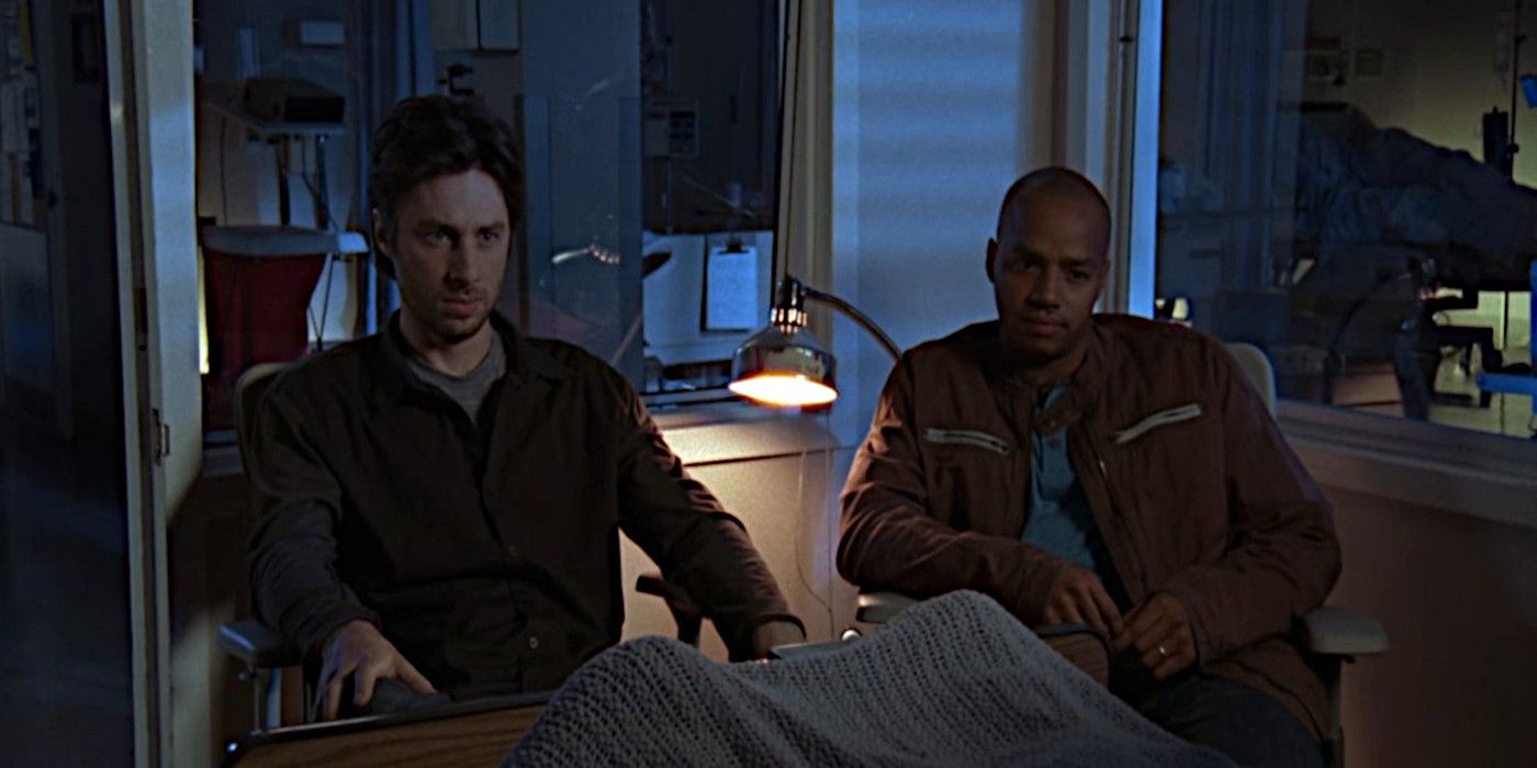 JD and Turk sit with a patient after their shift is over