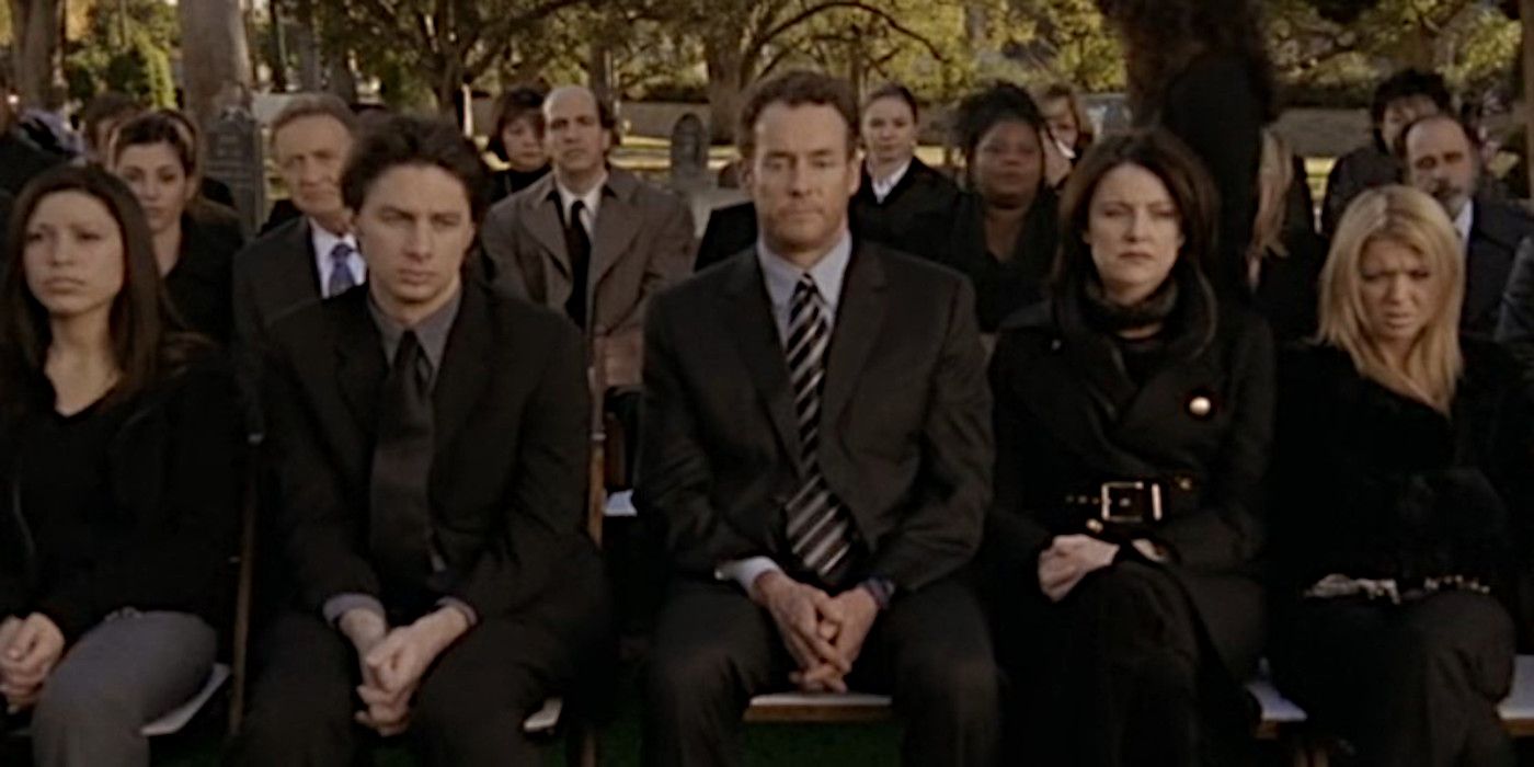 Dr. Cox attends a funeral with JD and Jordan sitting beside him.