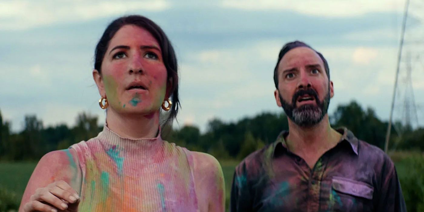 D'Arcy Carden and Tony Hale are covered in paint and crayon dust in a scene from Sketch