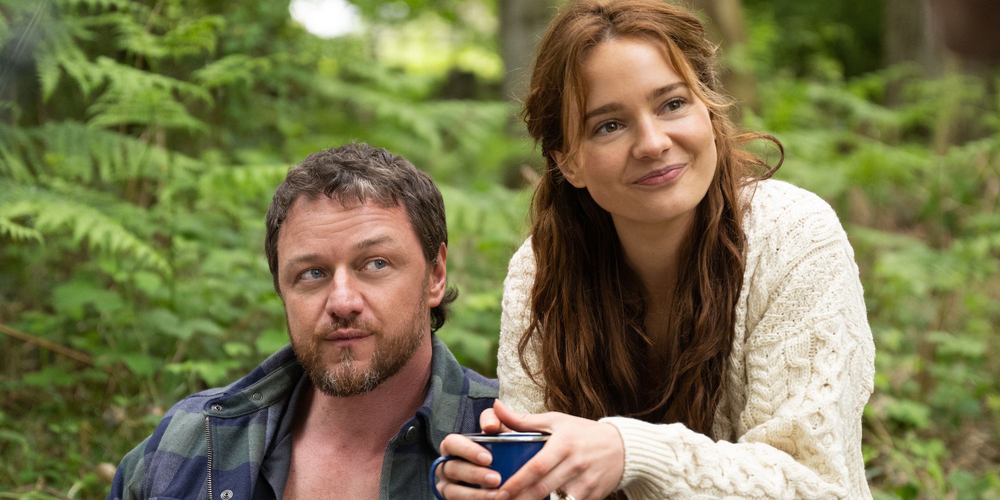 James McAvoy as Paddy and Aisling Franciosi as Ciara sit outside listening to someone in Speak No Evil