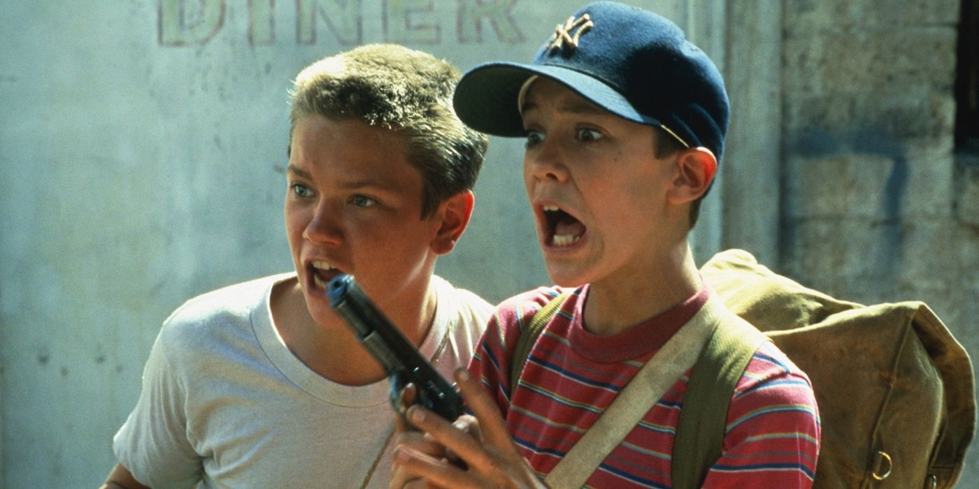 Chris and Gordie looking shocked with a gun in Stand by Me