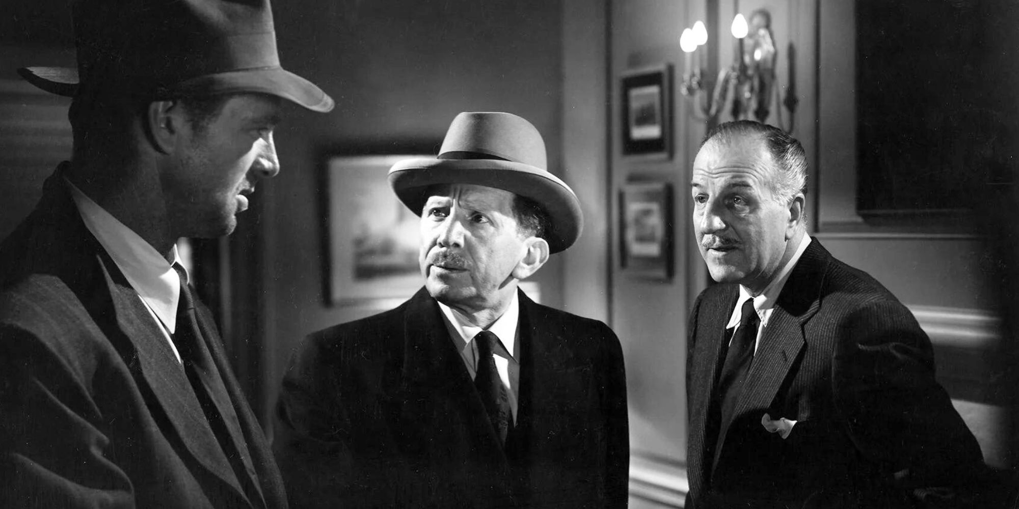 Sterling Hayden looking at Sam Jaffe and Louis Calhern in The Asphalt Jungle (1950)