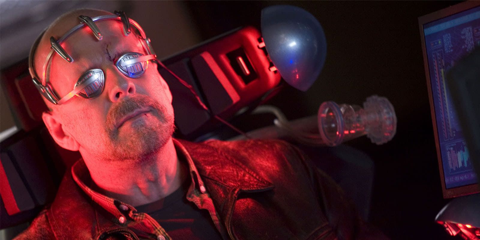 Bruce Willis as Tom Greer in Surrogates hooked up to a machine and wearing some wild eyewear in &lsquo;Surrogates&rsquo; (2009)