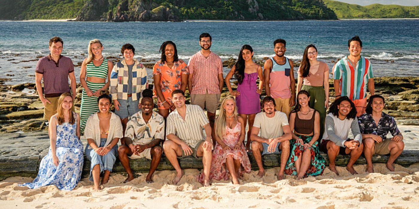 The cast of 'Survivor 47' poses in two rows for a group photo on the beach.