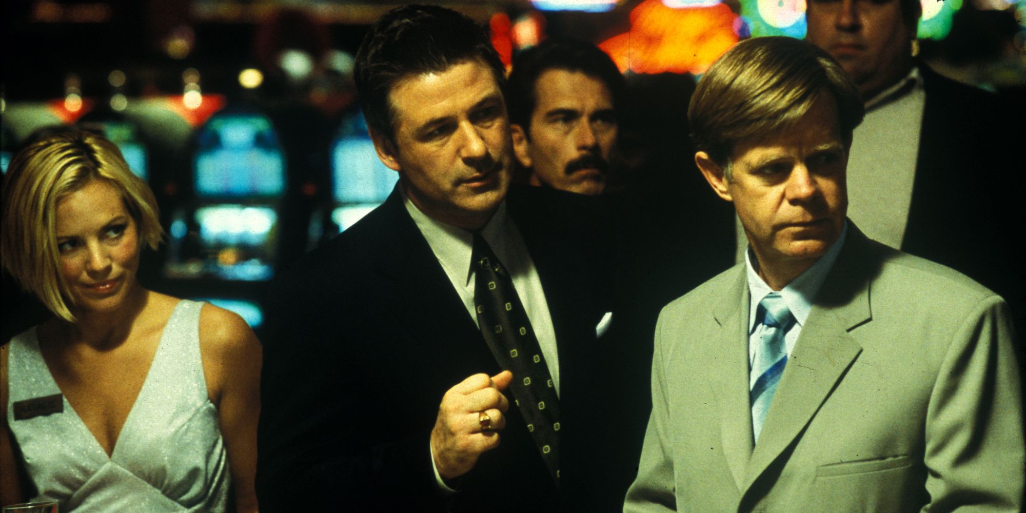 Maira Bello as Natalie, Alec Baldwin as Shelley, and William H. Macy as Bernie in a casino in The Cooler