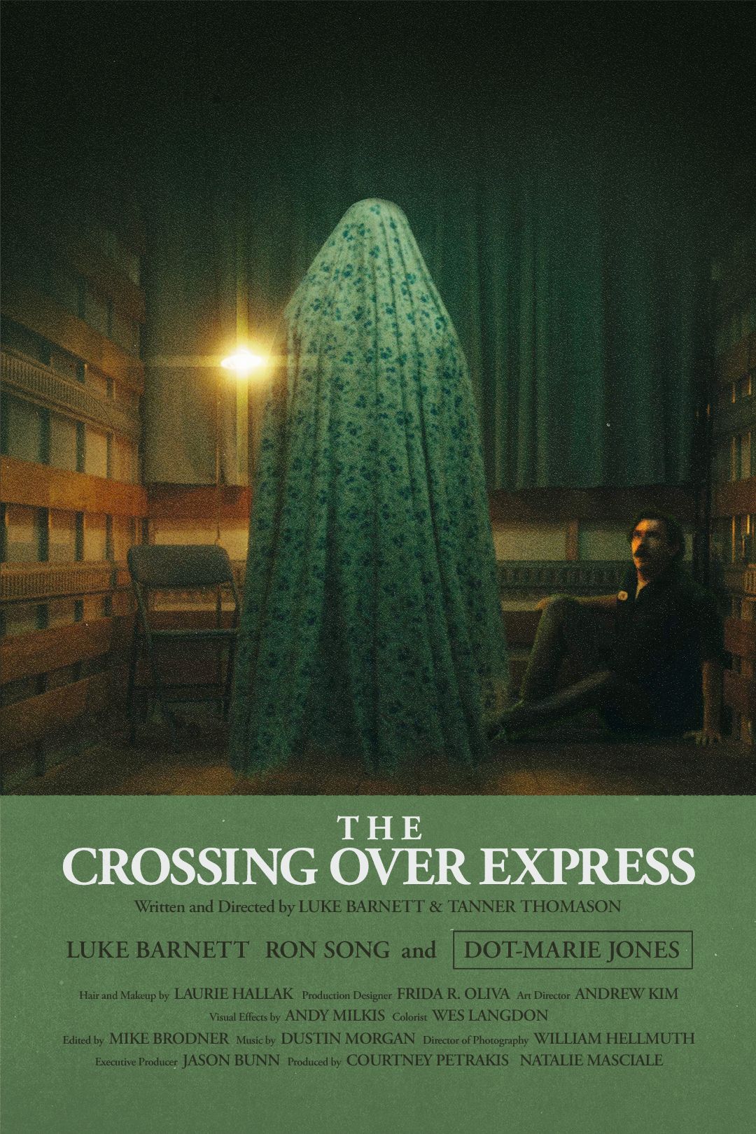 Luke Barnett cowers from a blanket ghost on the poster for The Crossing Over Express