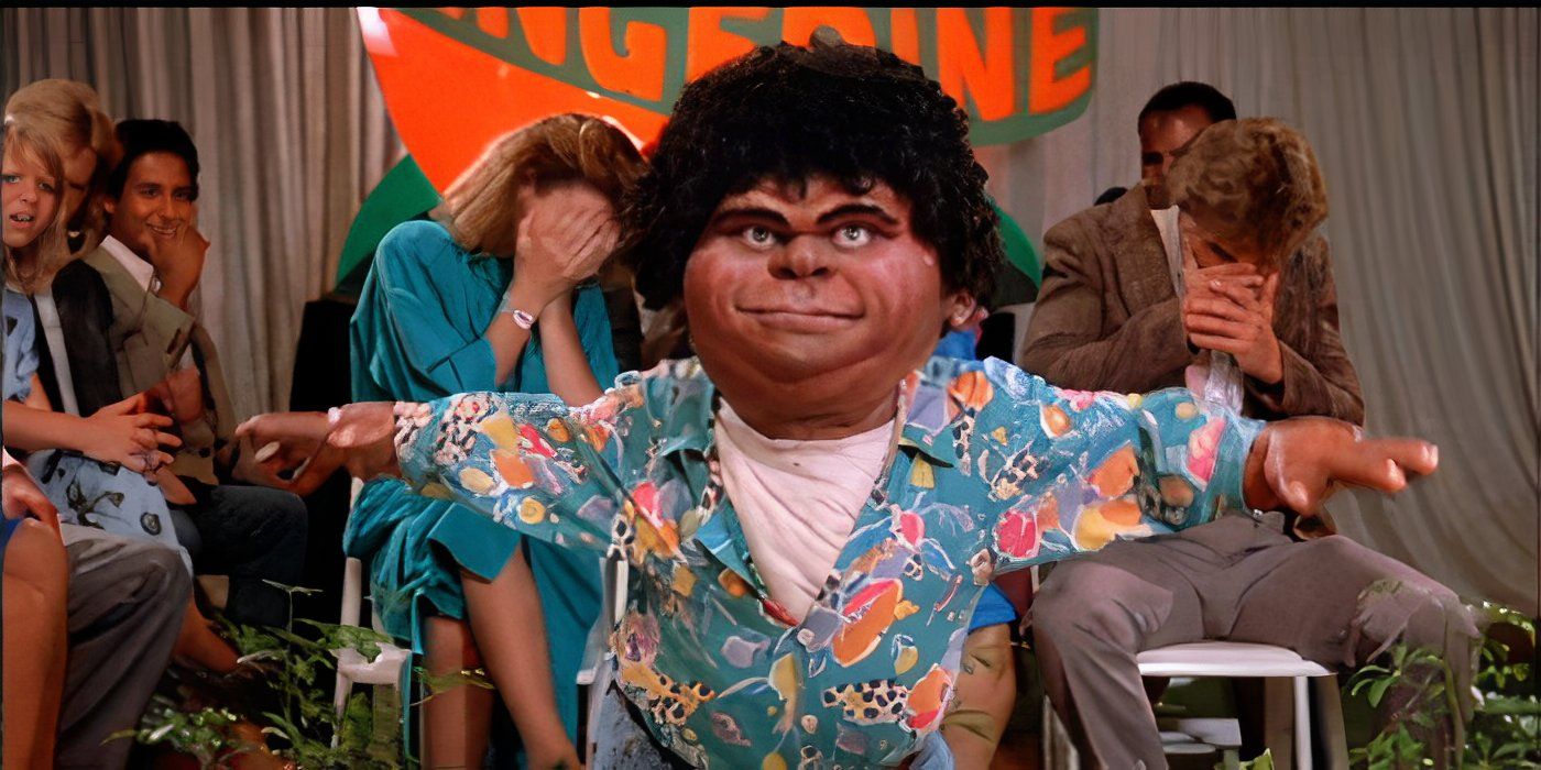 A character stands in front of a small crowd that cover their eyes in The Garbage Pail Kids Movie.