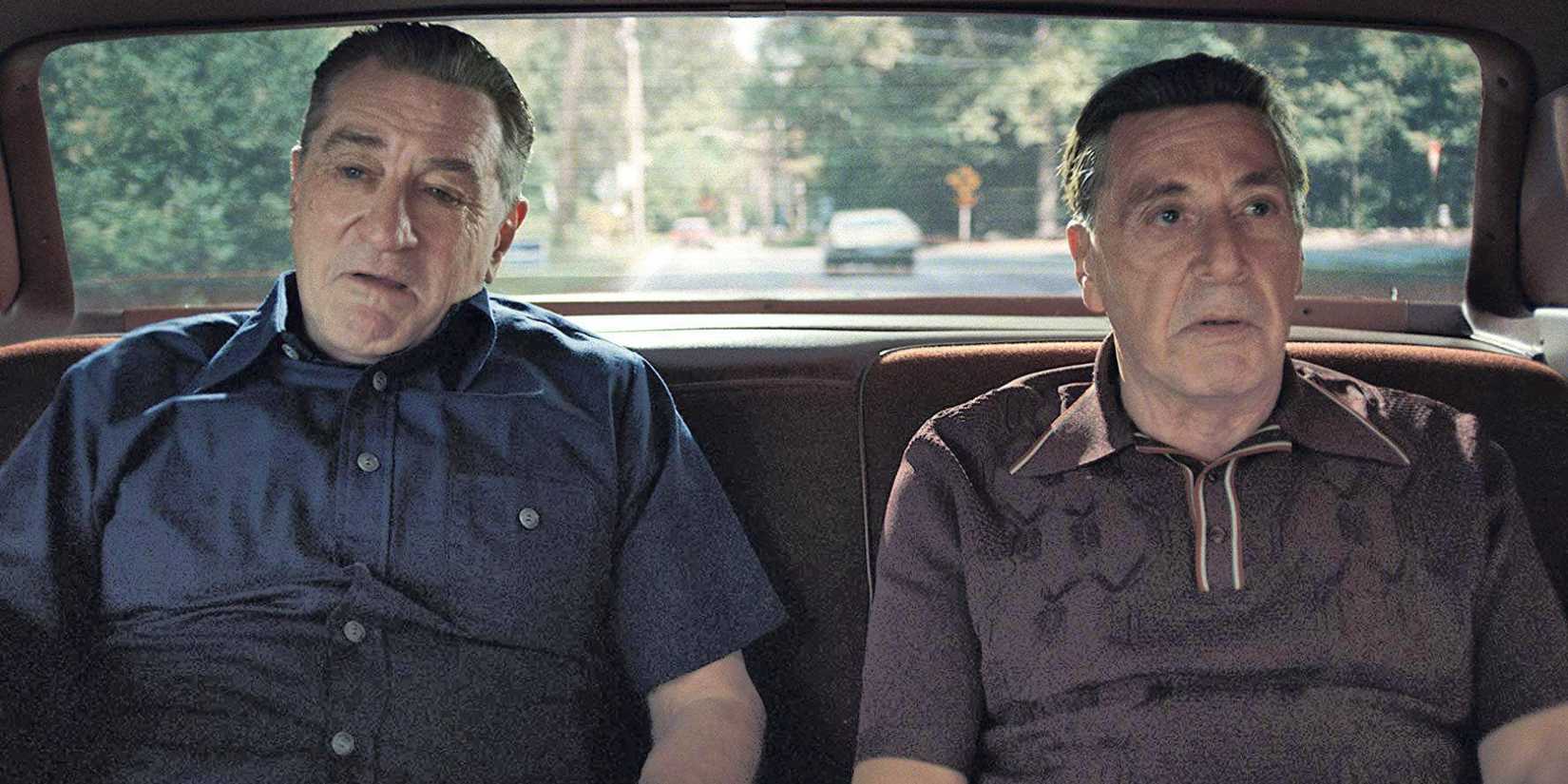 Robert De Niro and Al Pacino sitting next to each other in the back of a car in The Irishman (2019)