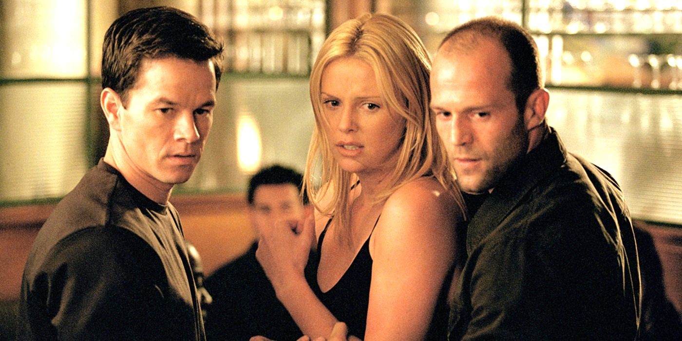 Mark Wahlberg, Charlize Theron, and Jason Statham look at someone off camera in disgust