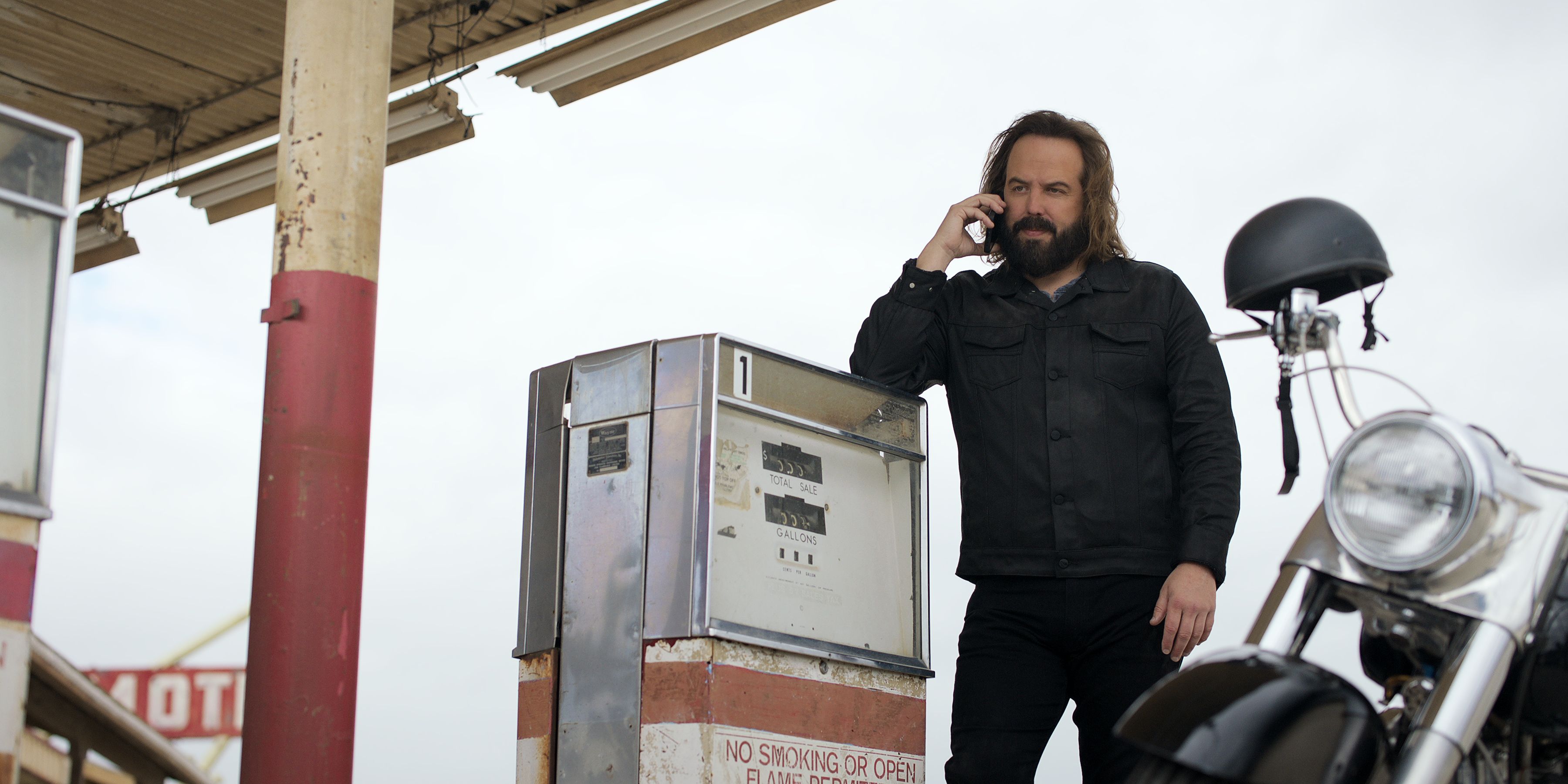 'The Lincoln Lawyer' Angus Sampson at gas station, talking on a cellphone