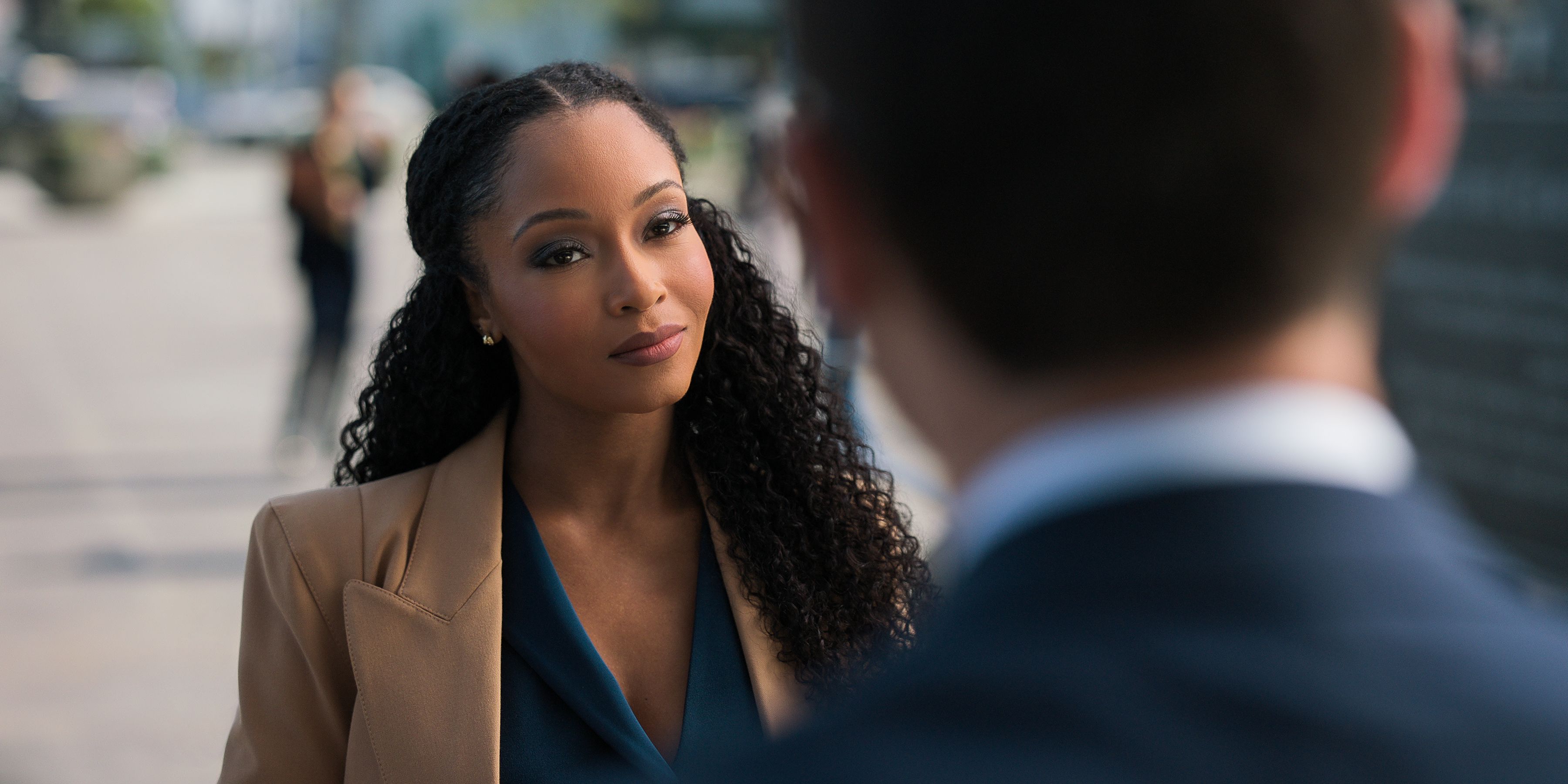 'The Lincoln Lawyer' Yaya DaCosta facing camera, talking to someone outside