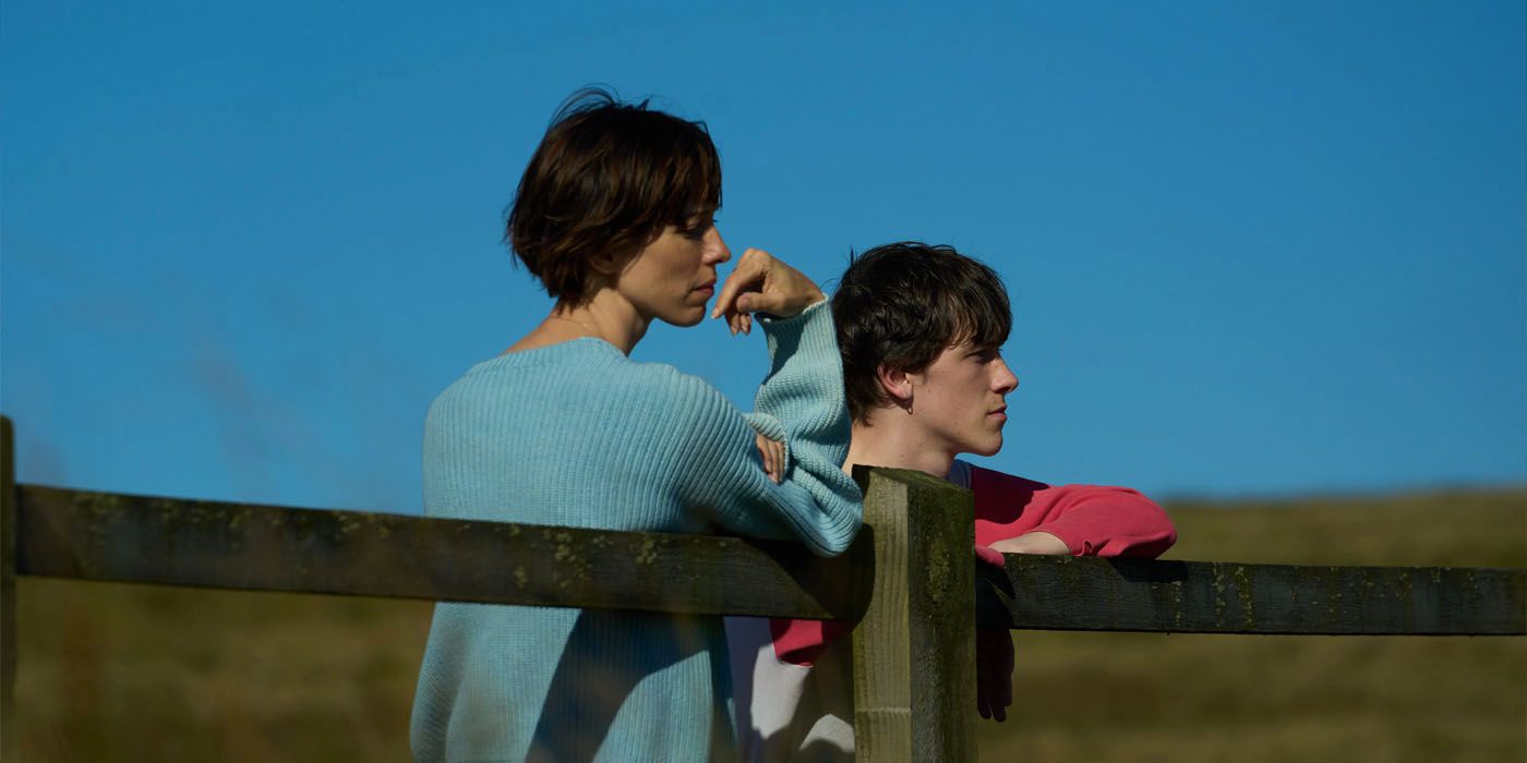 Rebecca Hall and Ollie West look off into the distance in a scene from The Listeners