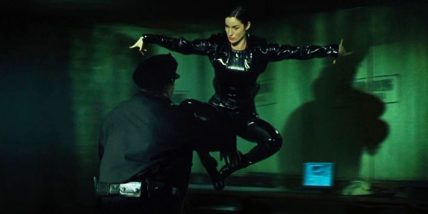 Carrie Anne Moss as Trinity throwing a kick in The Matrix