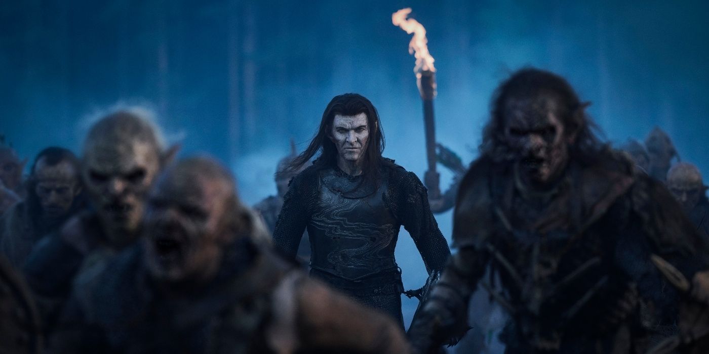 Sam Hazeldine as Adar walking with an army of orcs in The Rings of Power Season 2 Episode 7