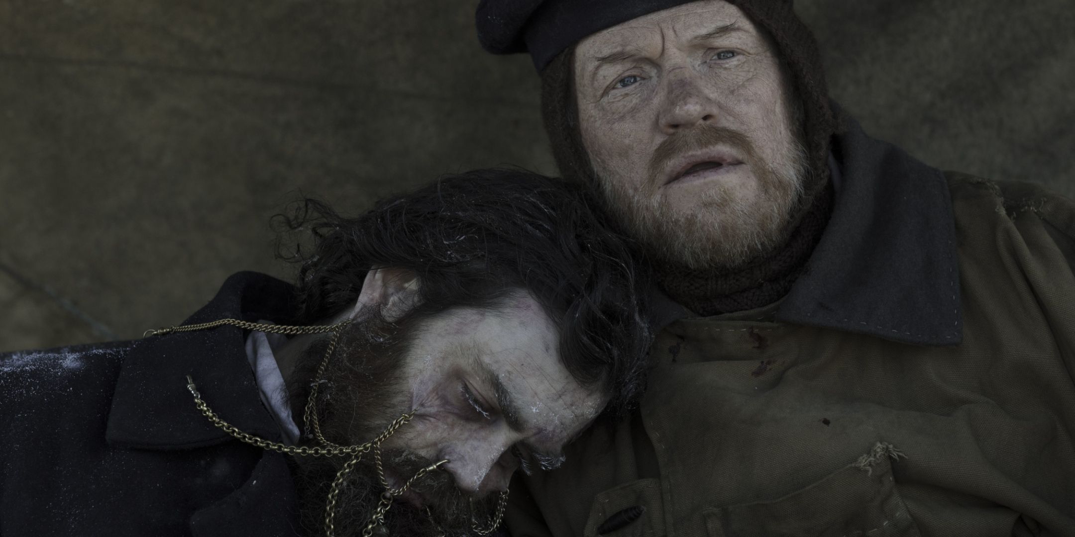 Jared Harris as Francis Crozier with dead person leaning on his shoulder in The Terror Season 1