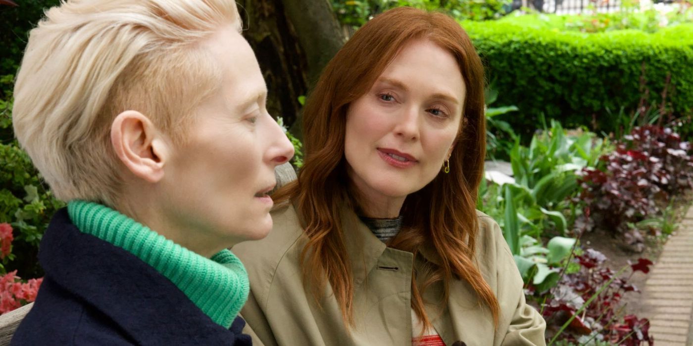 Julianne Moore and Tilda Swinton sit together on a bench in The Room Next Door.