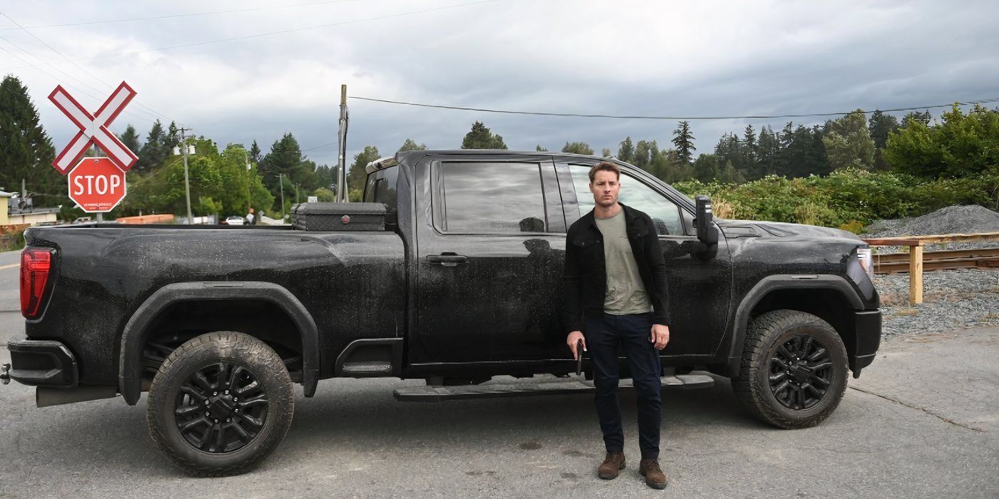 Justin Hartley as Colter Shaw standing in front of his truck on 'Tracker.'