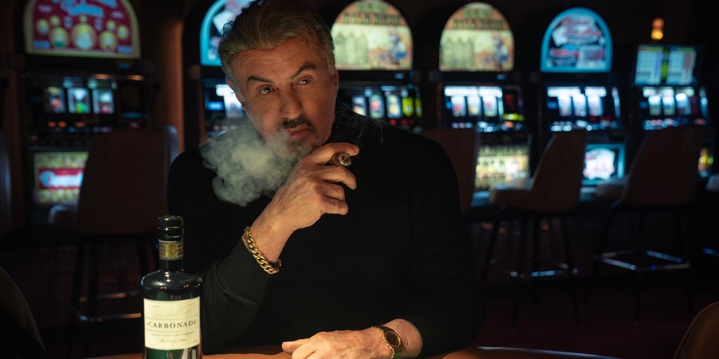 Sylvester Stallone smoking a cigar in a casino in Tulsa King Season 2