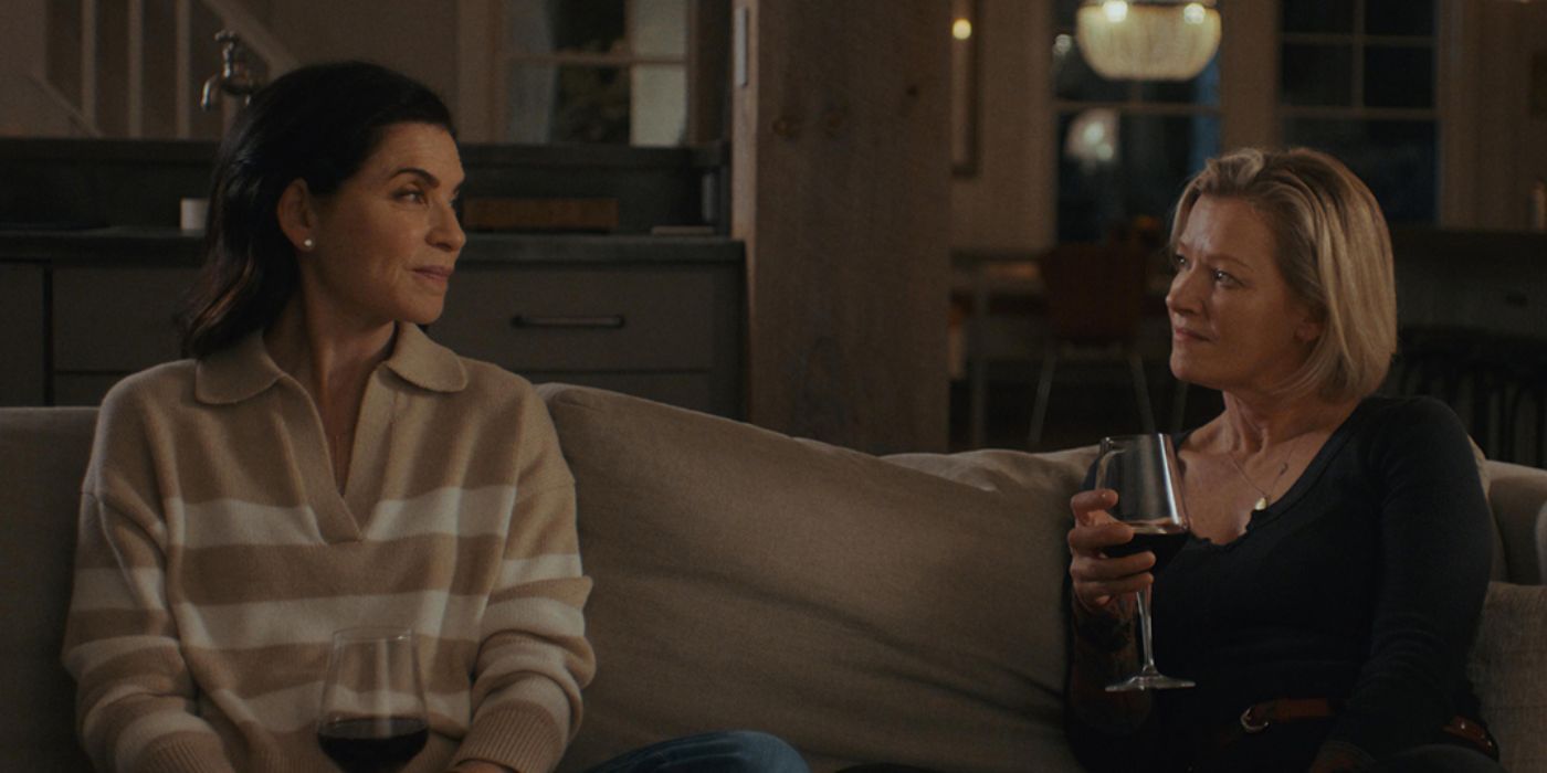 Gretchen Mol holding a glass of wine while sitting on the couch with Julianna Margulies in 'Millers in Marriage'.