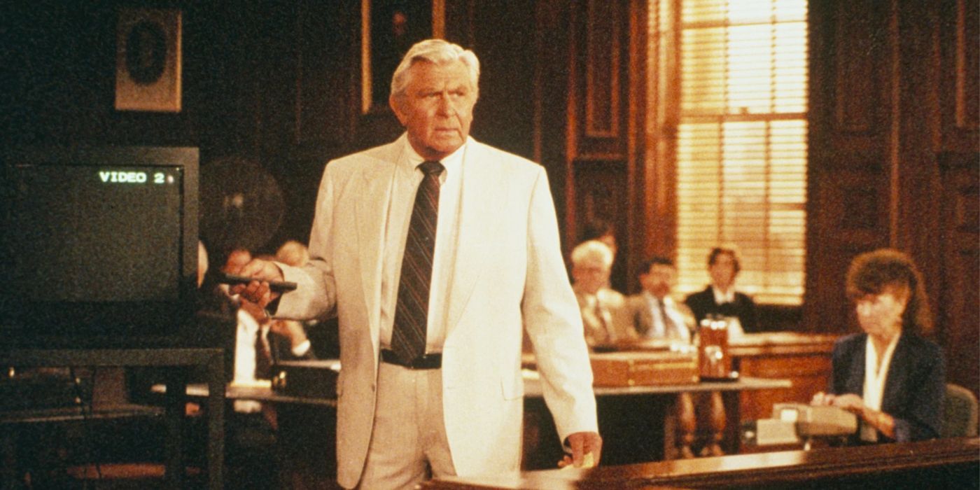 Andy Griffith wearing white suit and holding a remote control while in court in 'Matlock'.