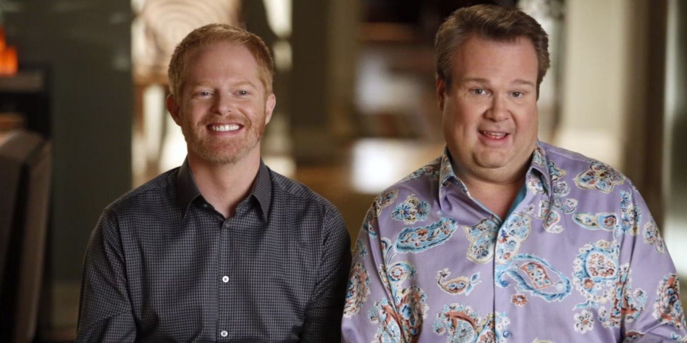 Actors Eric Stonestreet and Jesse Tyler Fergusson as husbands Mitch and Cam smiling in Modern Family.