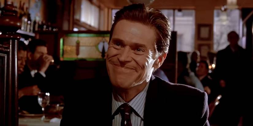 Donald Kimball smiling while at a bar in American Psycho