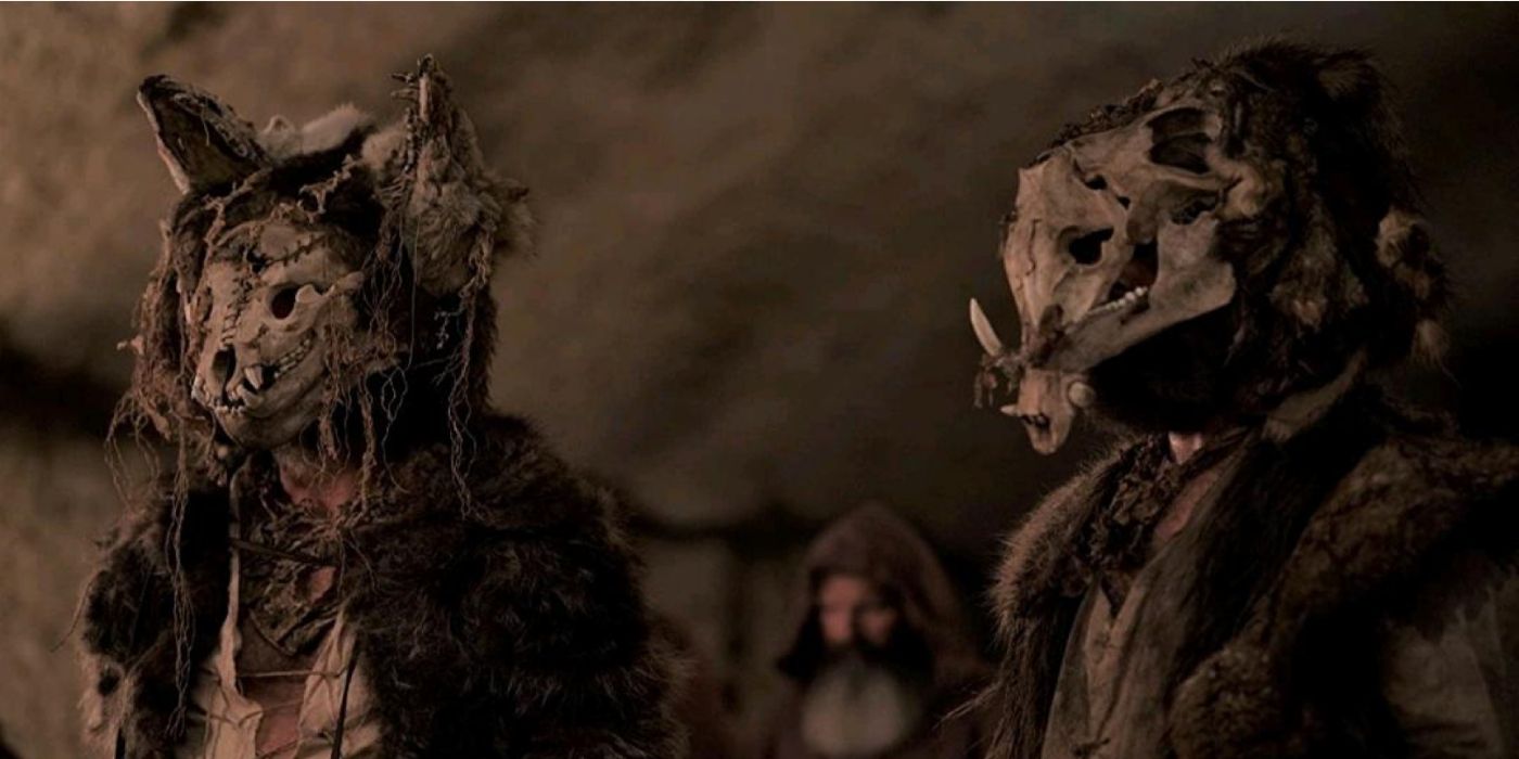Two people wear animal skull masks in 'Wrong Turn' (2021)