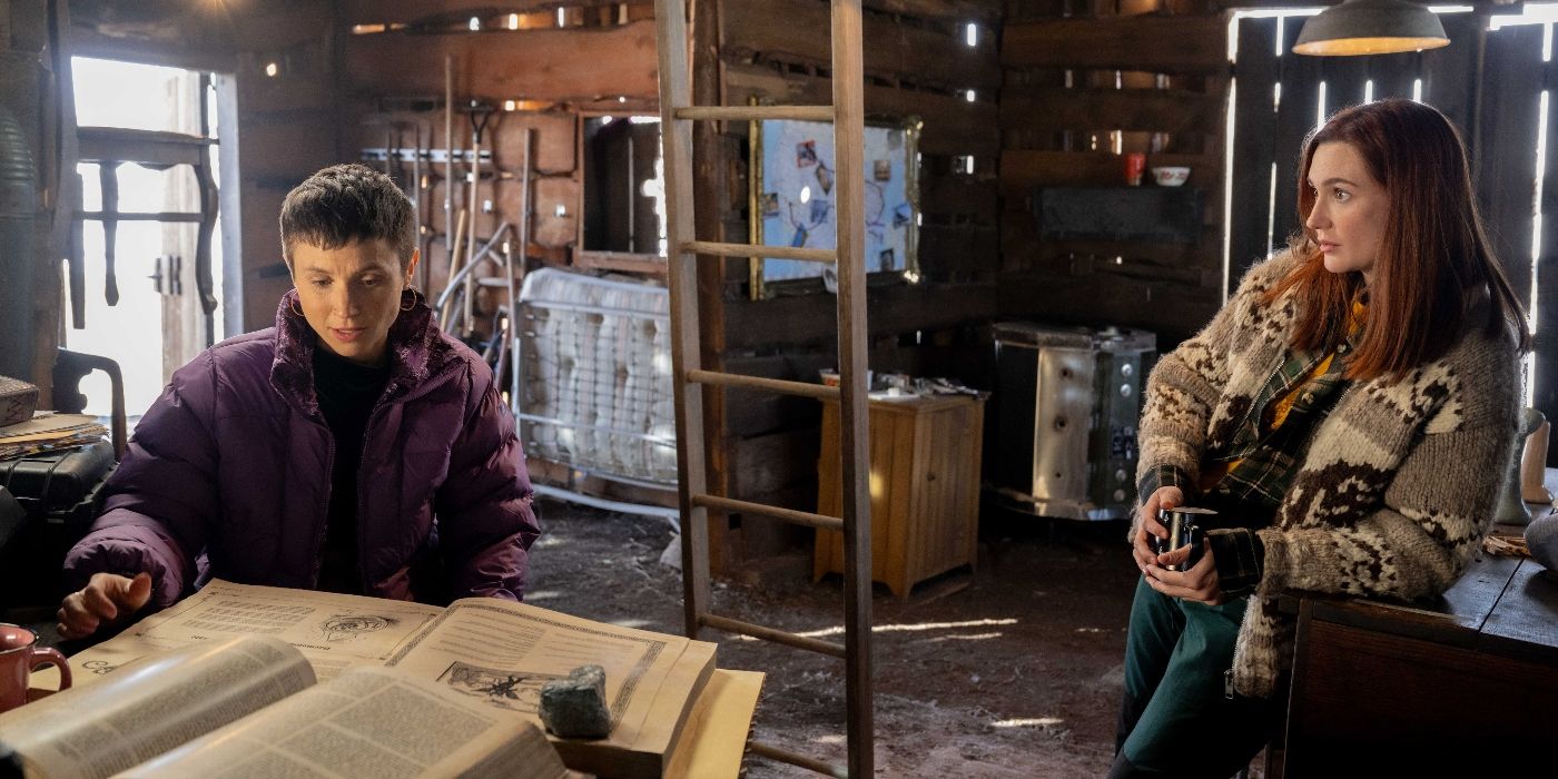 Dom Provost-Chalkley and Kat Barrell in the homestead barn in Wynonna Earp: Vengeance